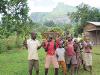 Ugandan children helping with the planting of saplings