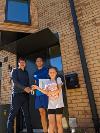 Councillor Holt with Aaron and Caitlyn as they settle into their new home
