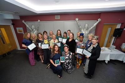 Cllr Nicholson and LEAP participants at the awards evening with Hannah (kneeling left) and Janine (kneeling right).