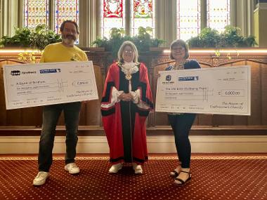 he Mayor of Eastbourne presenting cheques to Sean Towey (left) and Claire Howell (right)