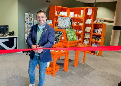 Cllr Denis at the new Tourist Information Centre Cllr Johnny Denis opening the new Tourist Information Centre at the Marine Workshops in Newhaven