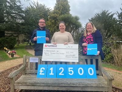 Council presents Parkinson’s UK with £12,500 donation